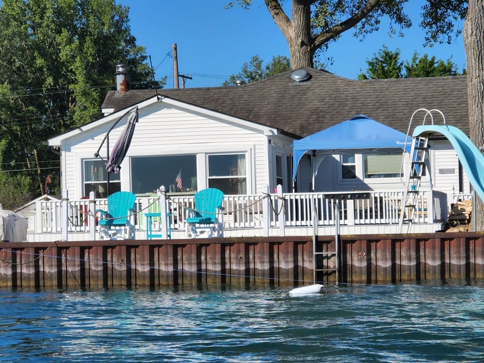 View from on a boat looking at the house 