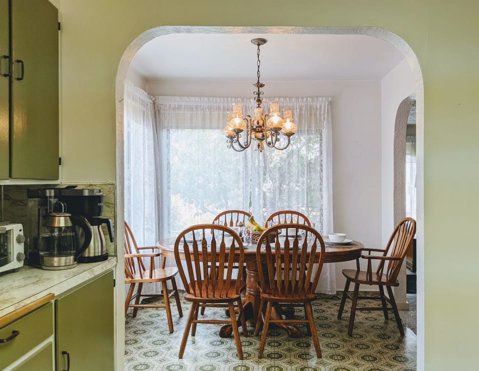 The Dining Room Table has a leaf for larger parties and extends to comfortably seat 6.