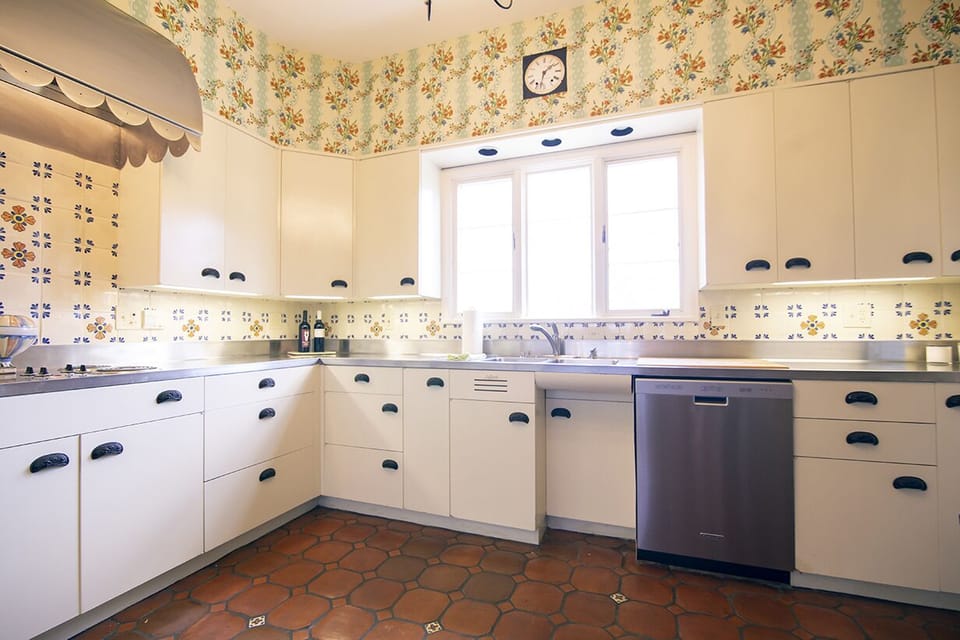 Kitchen features stainless steel countertops. View of mountains.