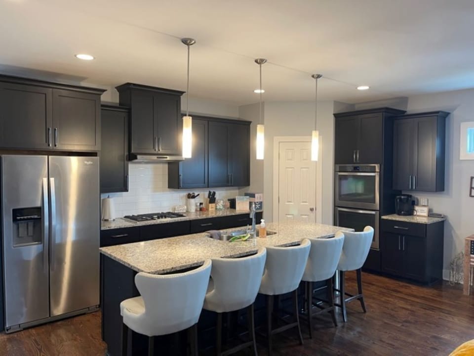 Wide Open Kitchen with Island to Gather as a Group and Provide Extra Seating 