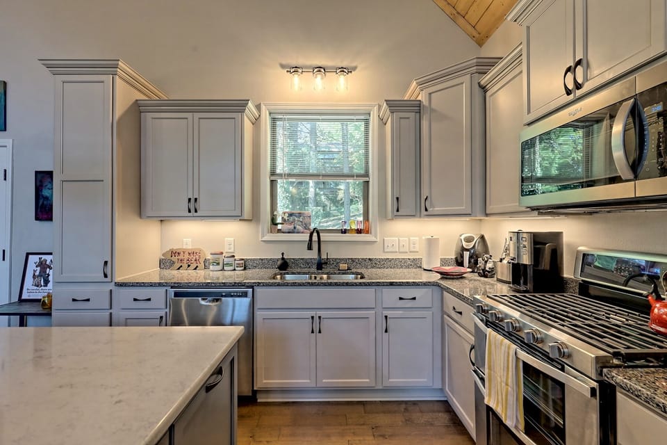 Spacious kitchen with gas range and all the appliances and cookware you'll need!