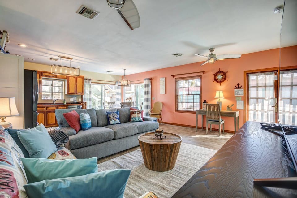 Bask in the radiant natural light that fills both the kitchen and living room, creating a warm and inviting atmosphere.