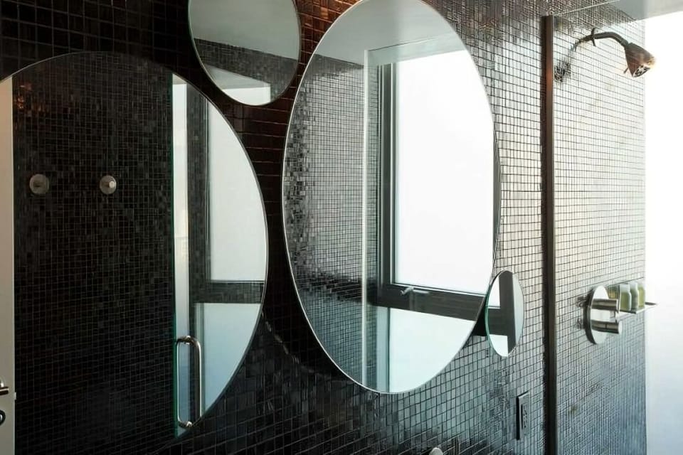 Step into a glossy tile shower for an energizing rinse