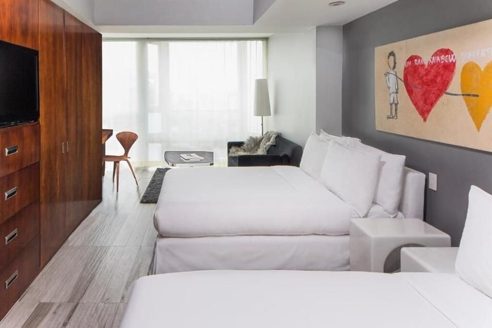 Relax together in a spacious suite with plush bedding.