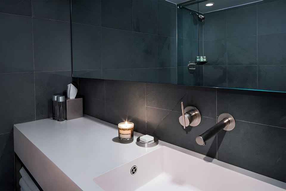 Enjoy a minimalist vanity setup with calming ambient lighting