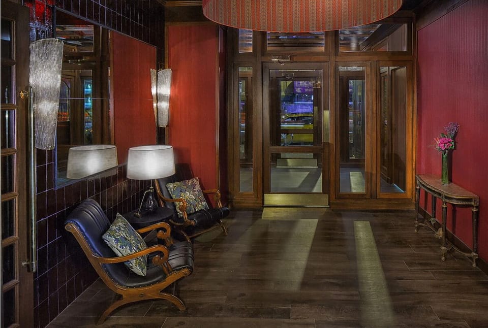Arrive to a moody lobby that feels private and polished.