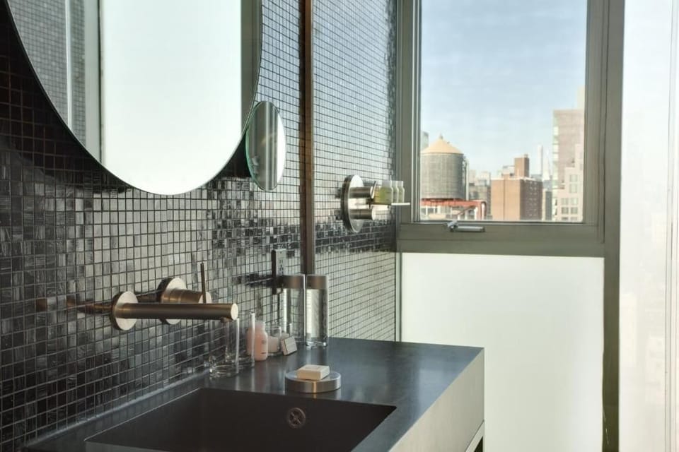 Lounge by the open window and watch the city glow.