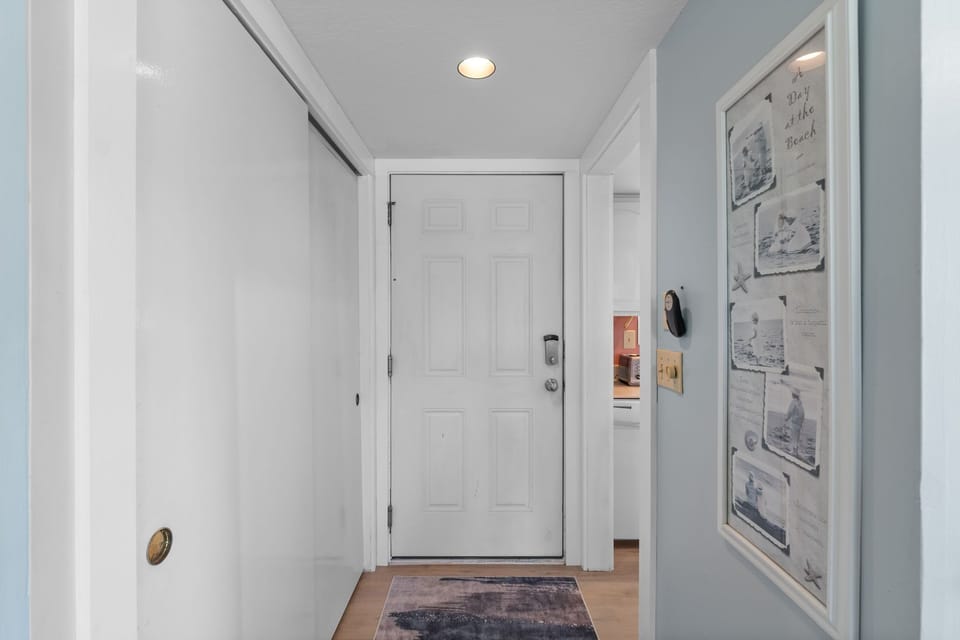 Step into your welcoming entryway with coastal artwork and thoughtful details that set the tone for your stay.
