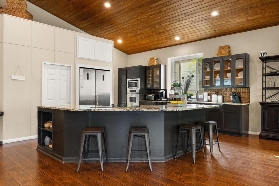 Spacious kitchen with large island seating, perfect for entertaining.