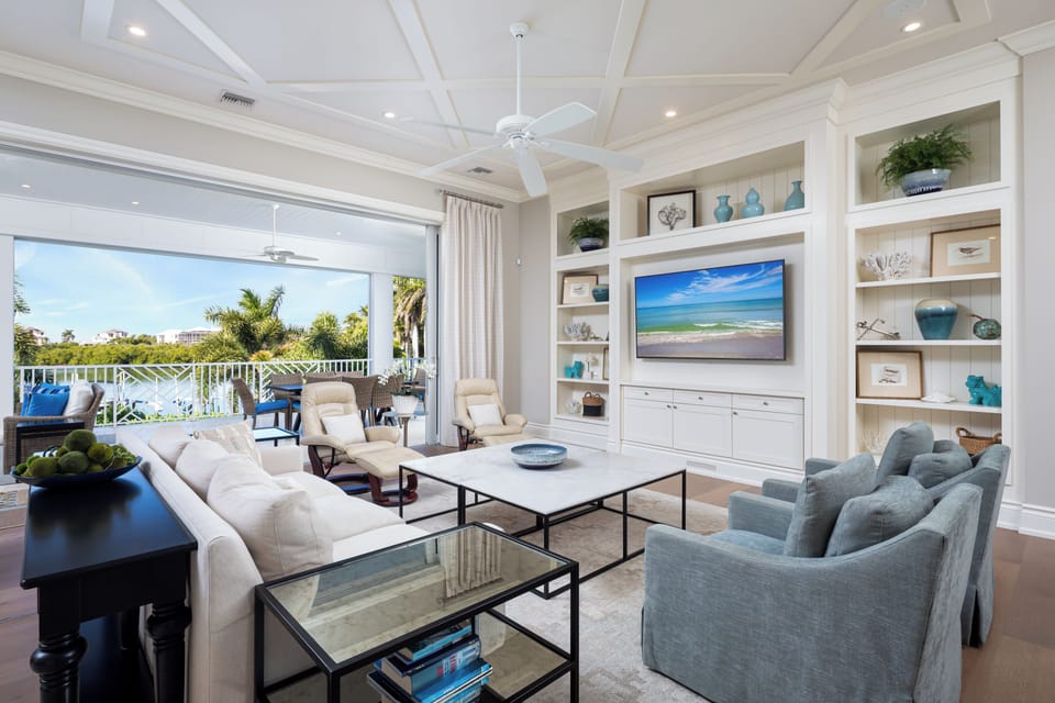Living Room w/ Large Smart TV, opens to Screened Lanai, Water Views  - 2nd Level