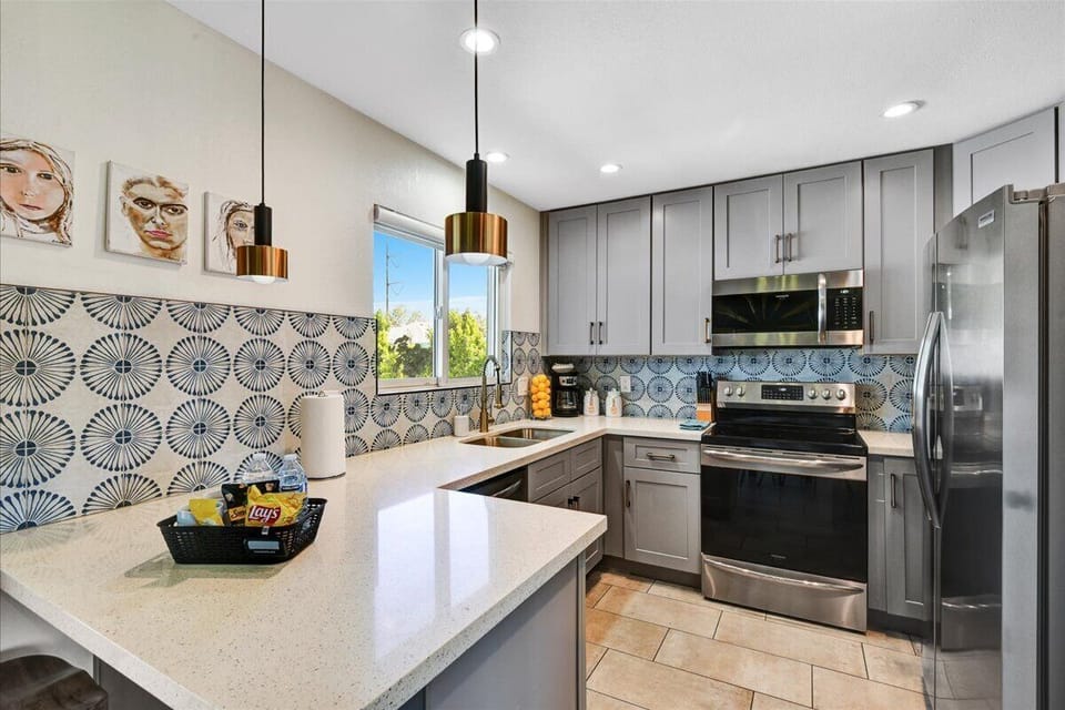 Open Kitchen with full size stainless steel appliances and fully stocked.