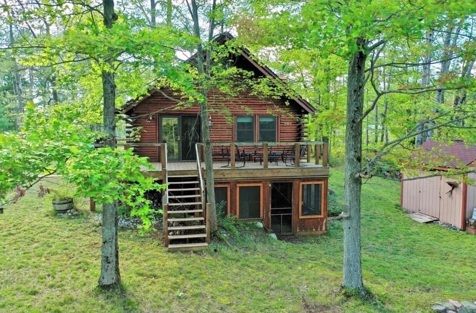 Back patio has a fire pit and seating with a gas grill 