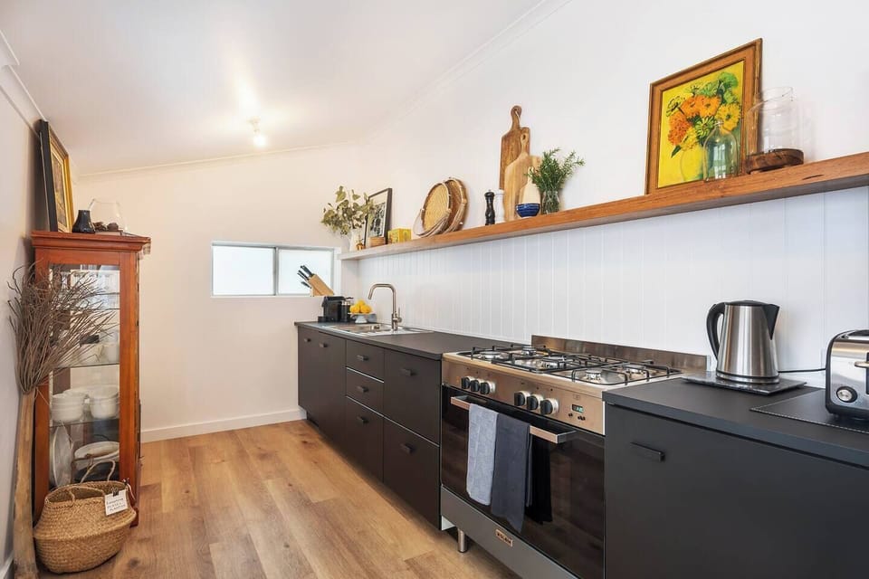 The kitchen is sleek and fully equipped to whip up a storm.