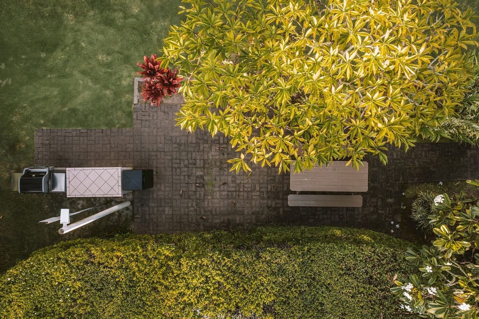Enjoy easy outdoor meals with grills and leafy shade.