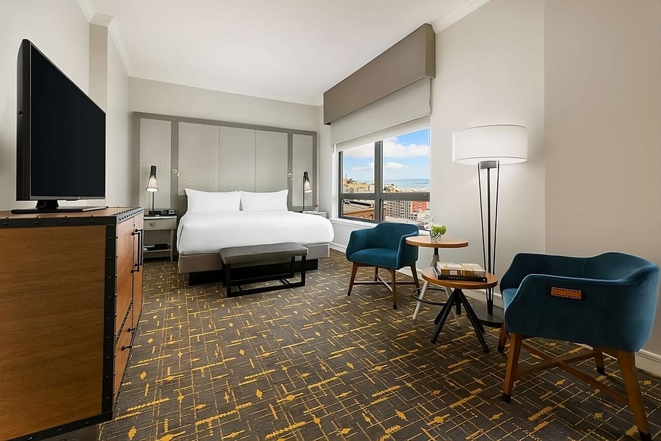 Lounge in stylish chairs and savor bright, airy views.