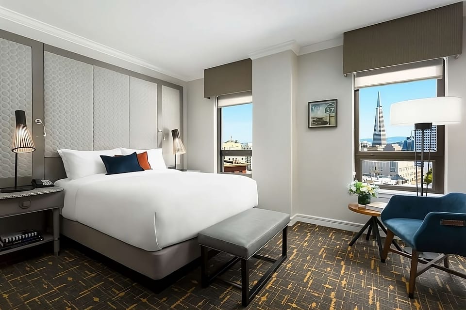 Sip coffee by the window while the city sparkles below.