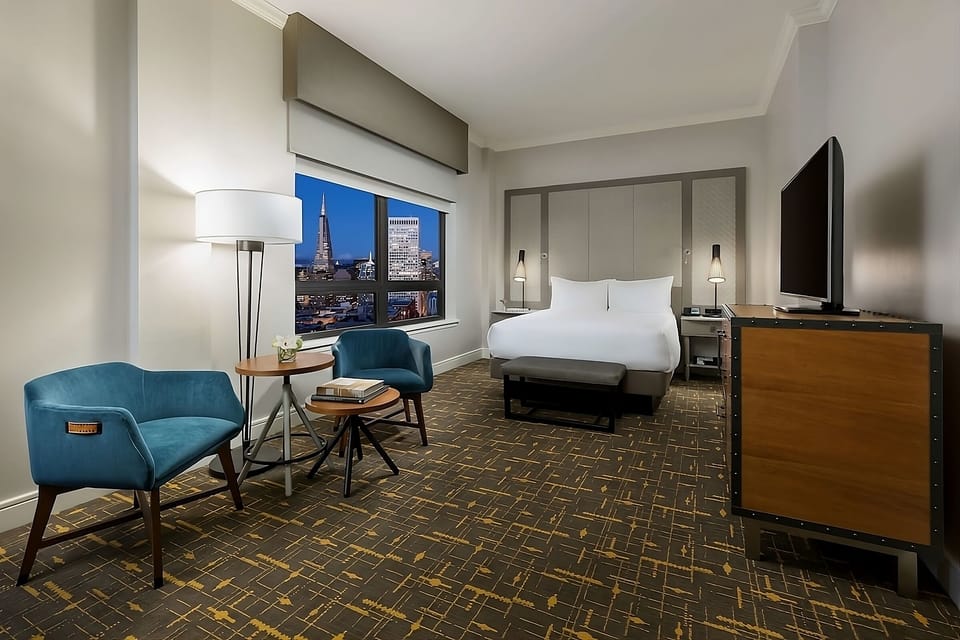 Relax by the window with skyline views and lounge seating.