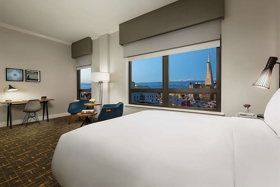 Wake up to iconic skyline views from your plush bed.