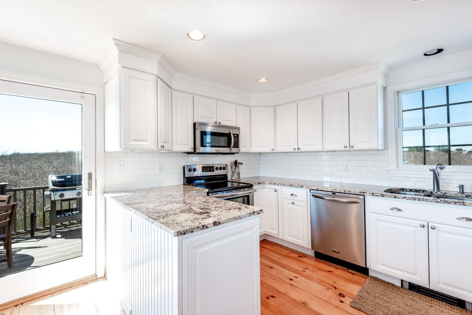 Granite and stainless modern kitchen is fully equipped for your cooking needs. 