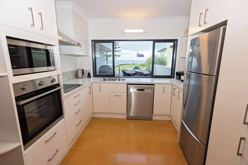Kitchen with servery window to patio