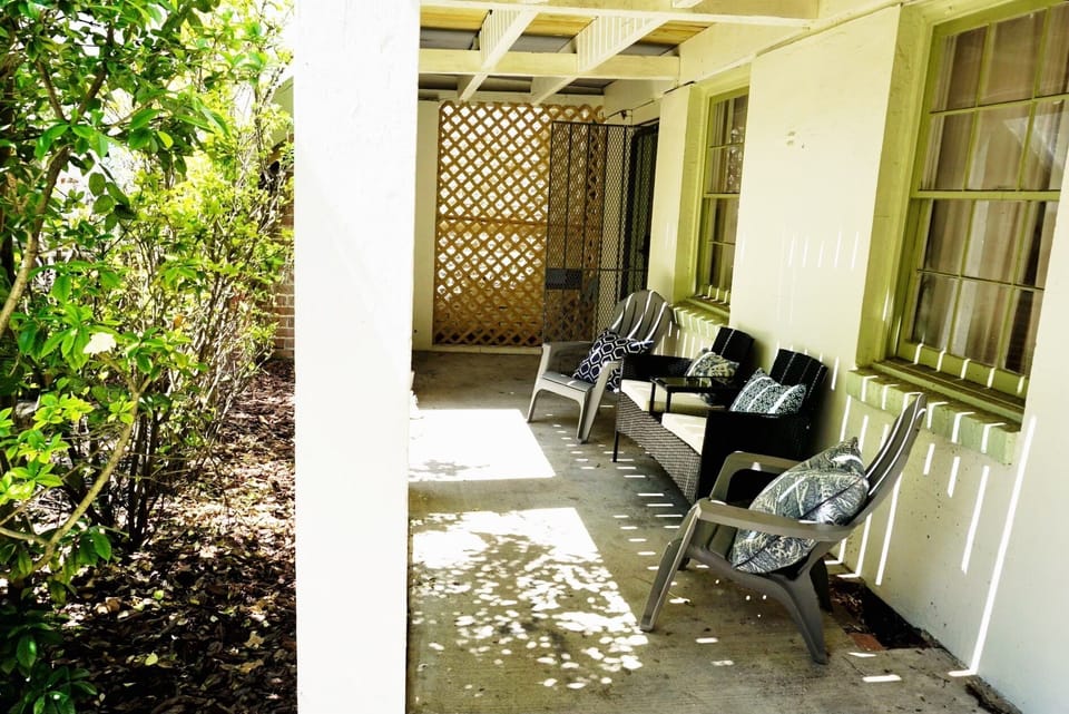 There are multiple seating areas throughout the covered terrace.