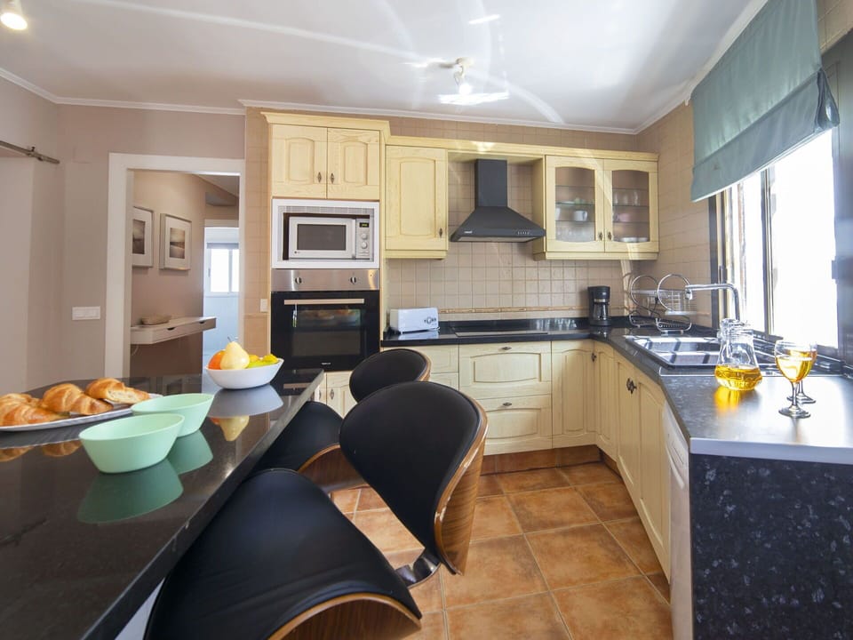 Cabinetry, Countertop, Property, Furniture, Kitchen, Wood, Chair, Interior Design, Kitchen Appliance, Sink