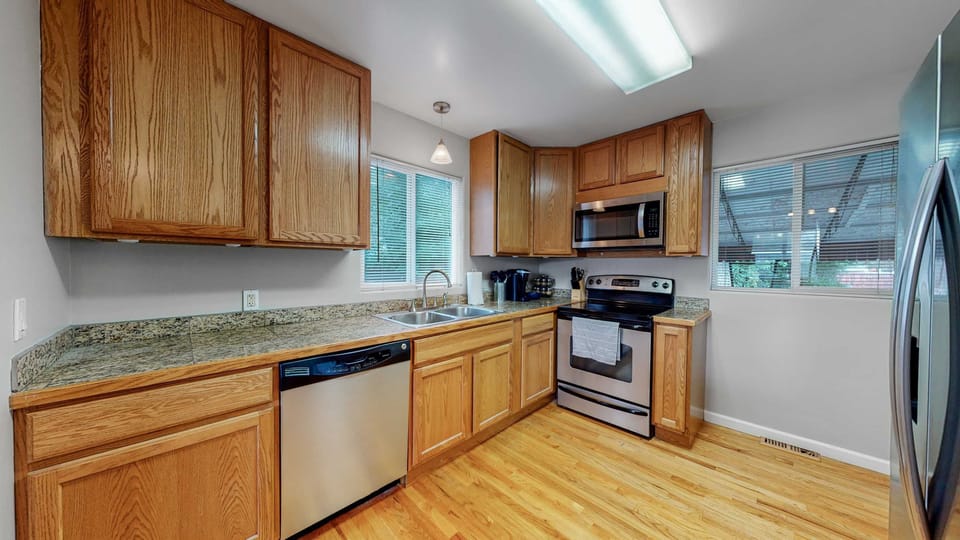 Love the warm and inviting feel of the wood cabinets in this kitchen.