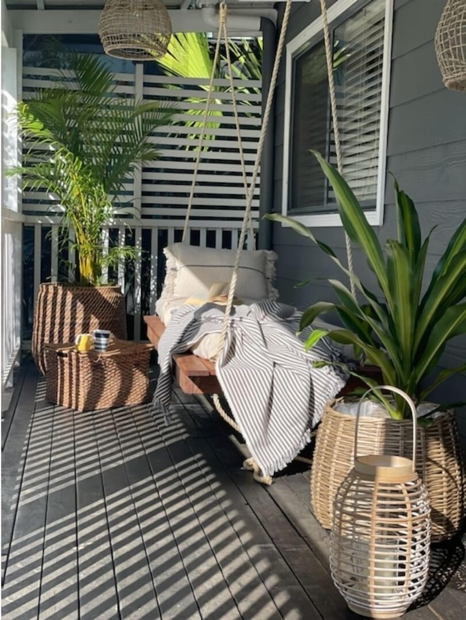 Outdoor hanging swing bench, perfect to relax on with a cup of tea and read