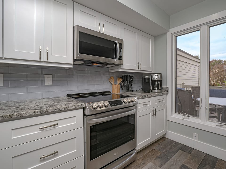 Granite countertops and tiled back splash.