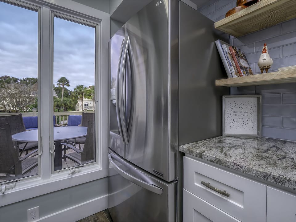 A large window highlights the front deck. Ample counter space