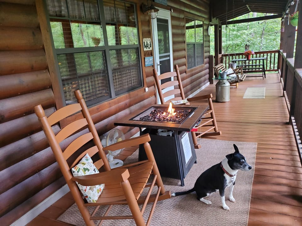 The 2 rocking chairs and the porch swing for 2 for  relaxing anytime of the day.