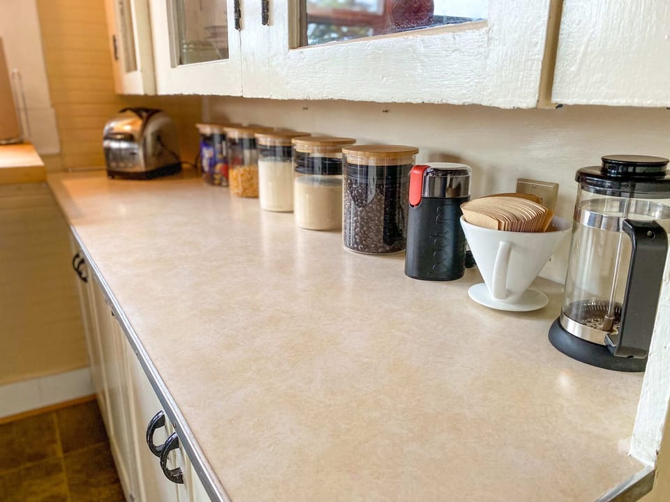 French press or pour-over? You decide! And, help yourself to the flour, sugar, popping corn, and assorted sweets, too!