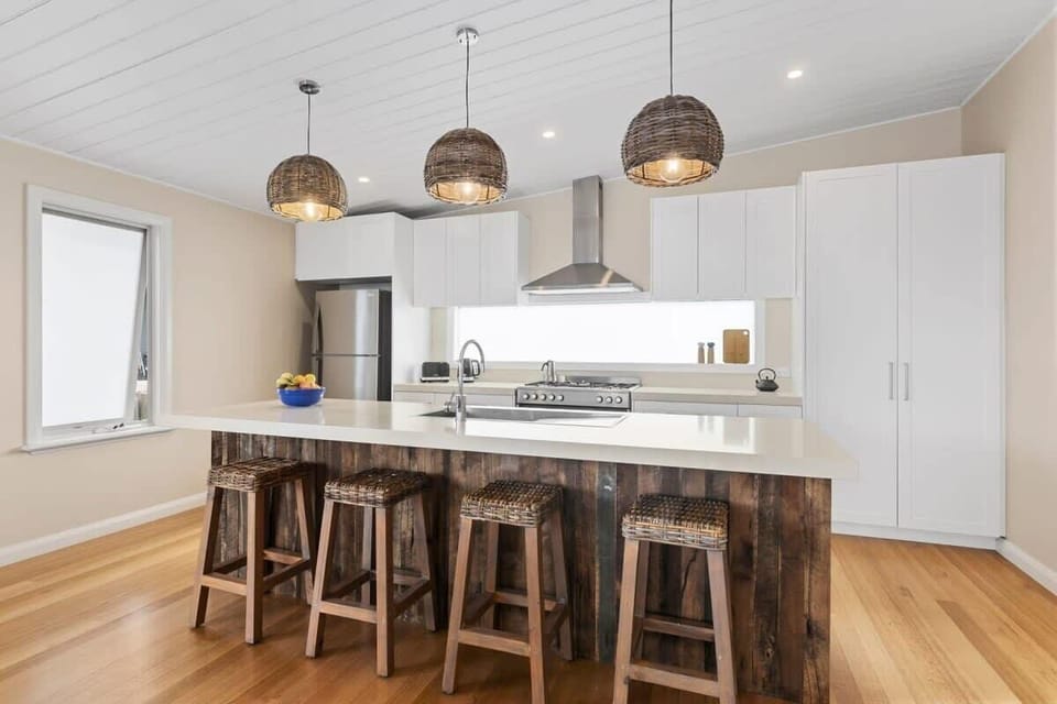 The kitchen is designed for culinary enthusiasts, featuring high-quality appliances