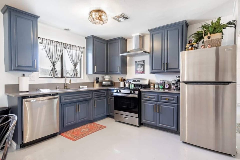 Fully equipped kitchen with modern appliances and ample storage