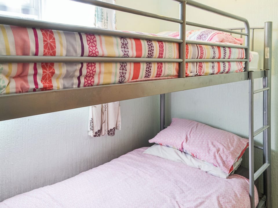 Bunk bedroom | Enjoy Your Stay Cottage, Bridlington