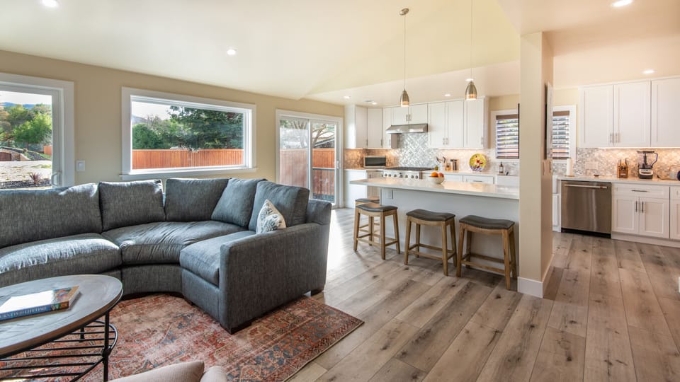 Open concept great room with views of the backyard and Vaca mountains.