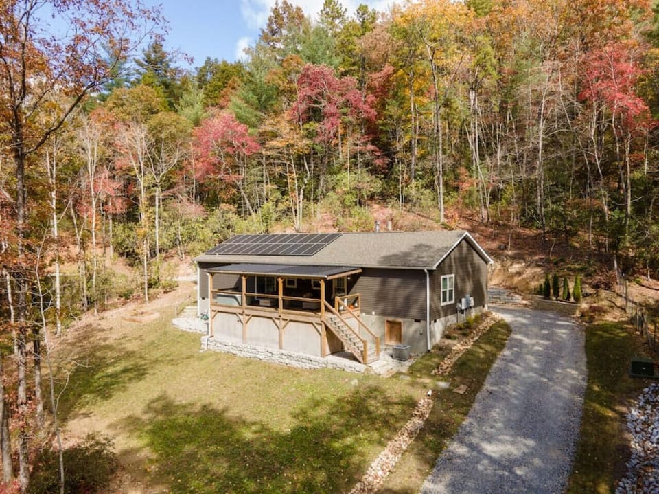 Nestled right on the line of the Pisgah National Forest, this home is a great escape from the day to day routine.  Quiet and relaxing is what you get here, and with private access to the river across the street, a calm stay here is just the beginning.