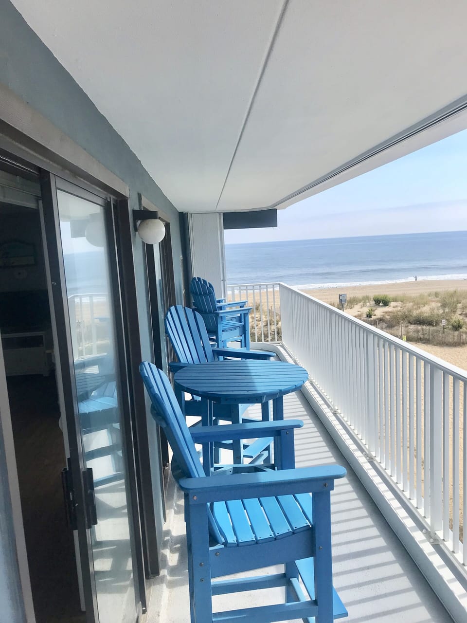 large deck over looking the beach and ocean. 