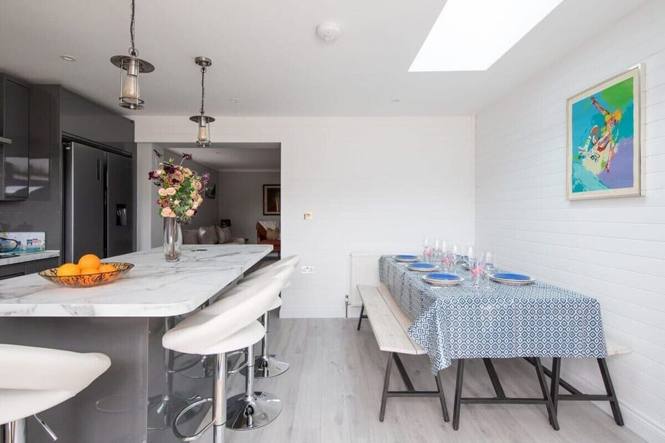 The living room opens up into the fully equipped kitchen with the dining area.