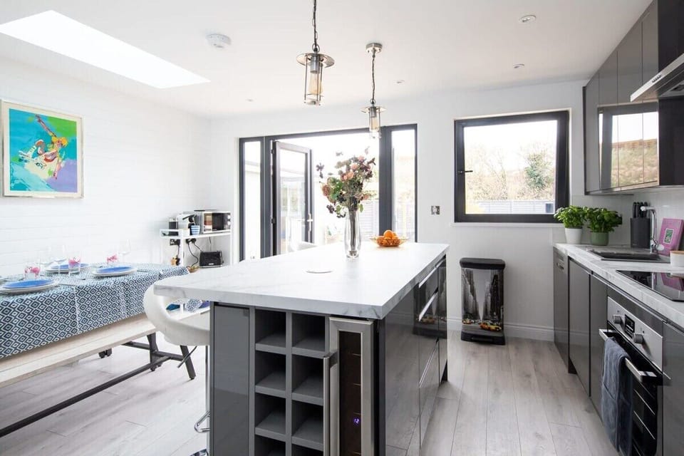 Large kitchen island is a perfect gathering place.