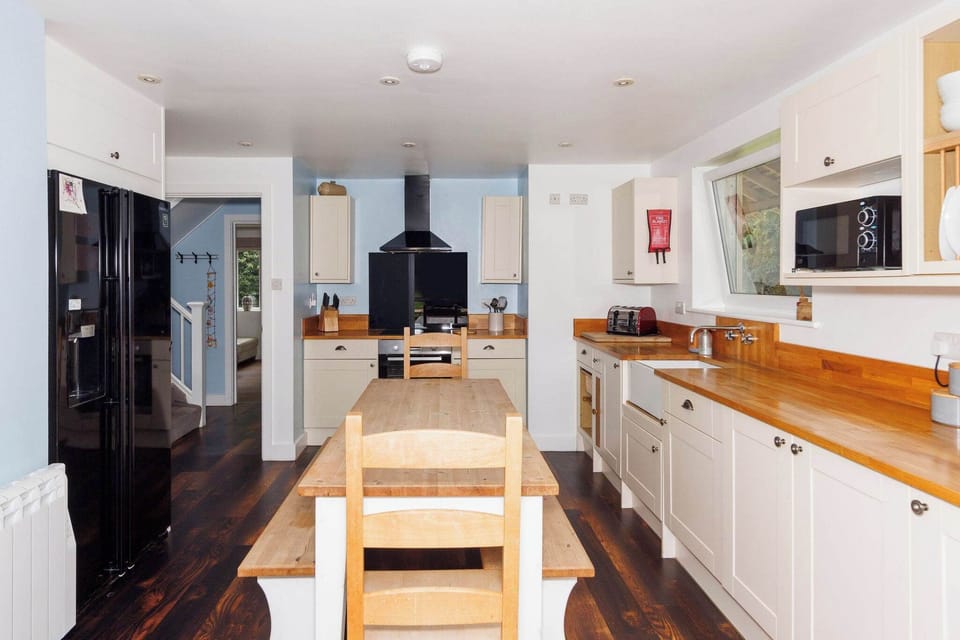 The fully-equipped kitchen has everything you need to prepare drinks and meals.