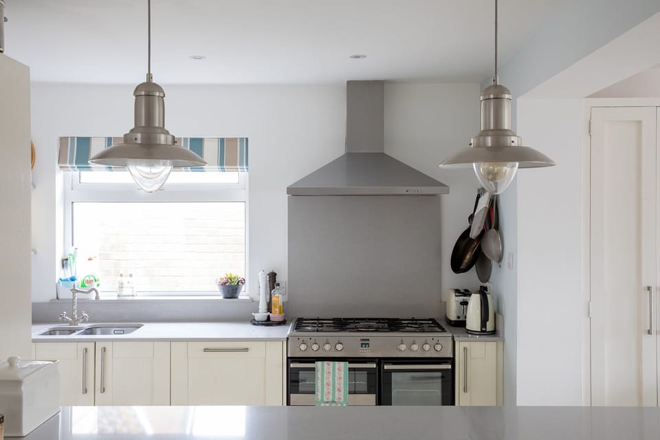 State-of-the-art cooking appliances wait for you in the fully-equipped kitchen.