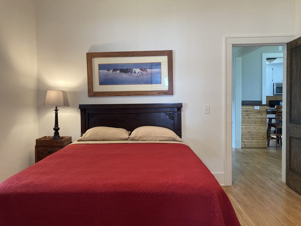 Main floor bedroom with queen bed. 