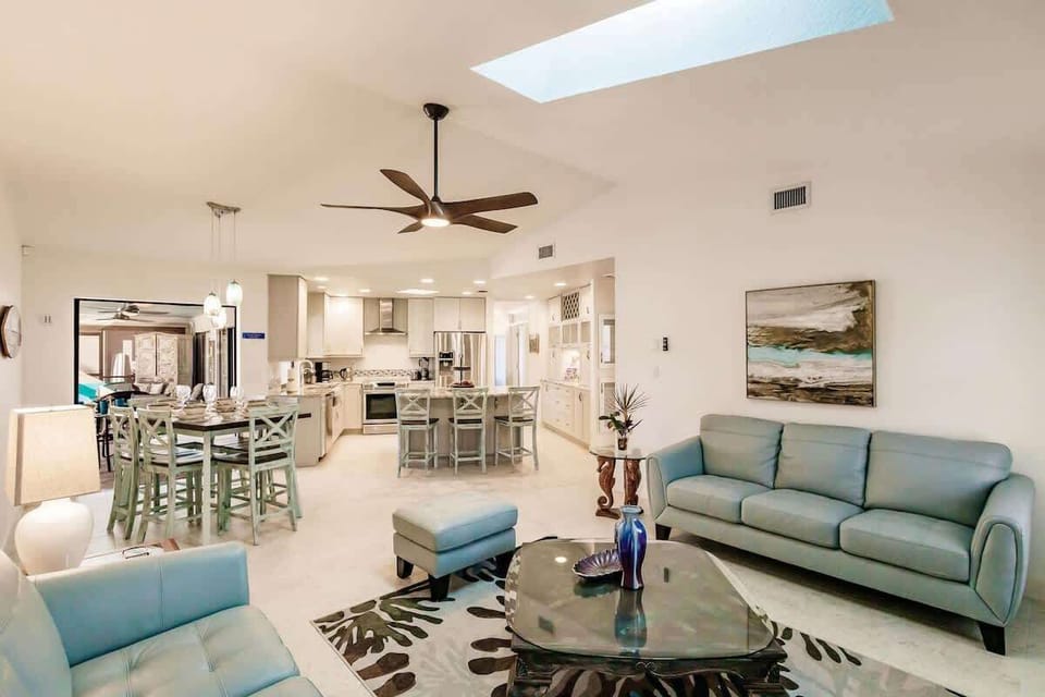 main living room with open concept dining and kitchen 