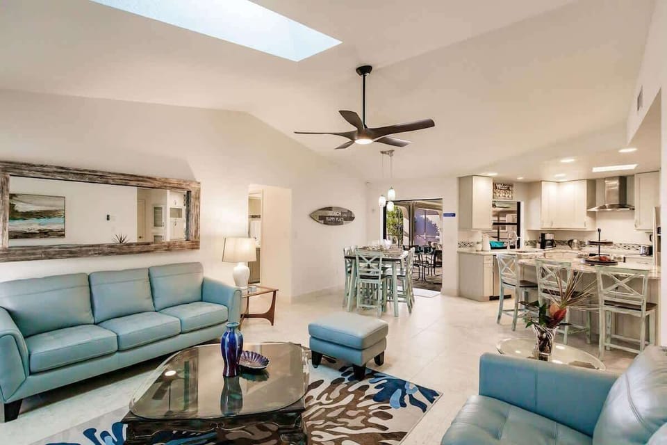 main living room with open concept dining and kitchen 