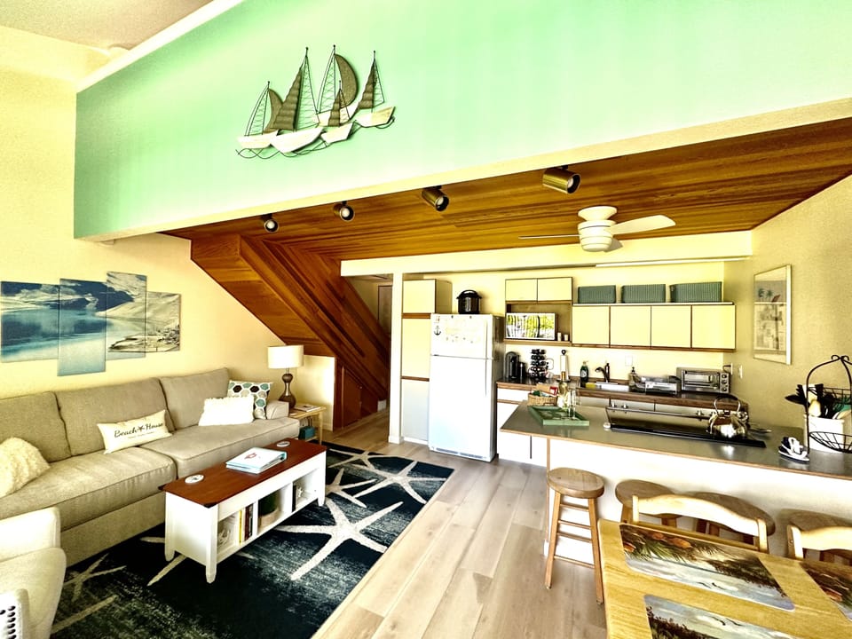 Dining table for 4 and 4 barstools. Portable booster seat under bed in loft.