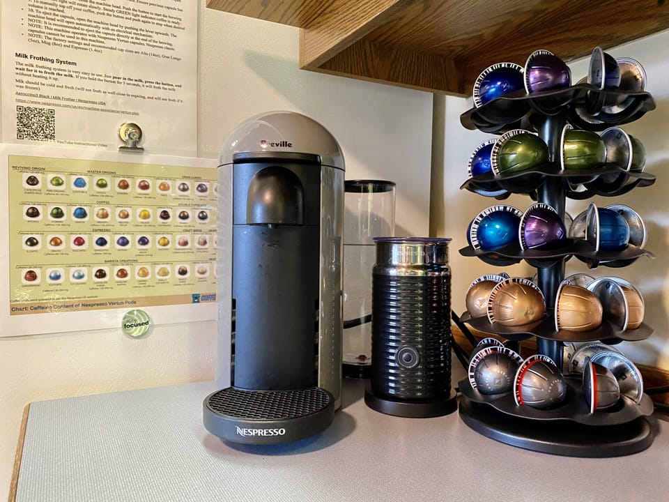 Nespresso Vertuo Plus w/milk frother, & variety of pods, syrups, and sweeteners