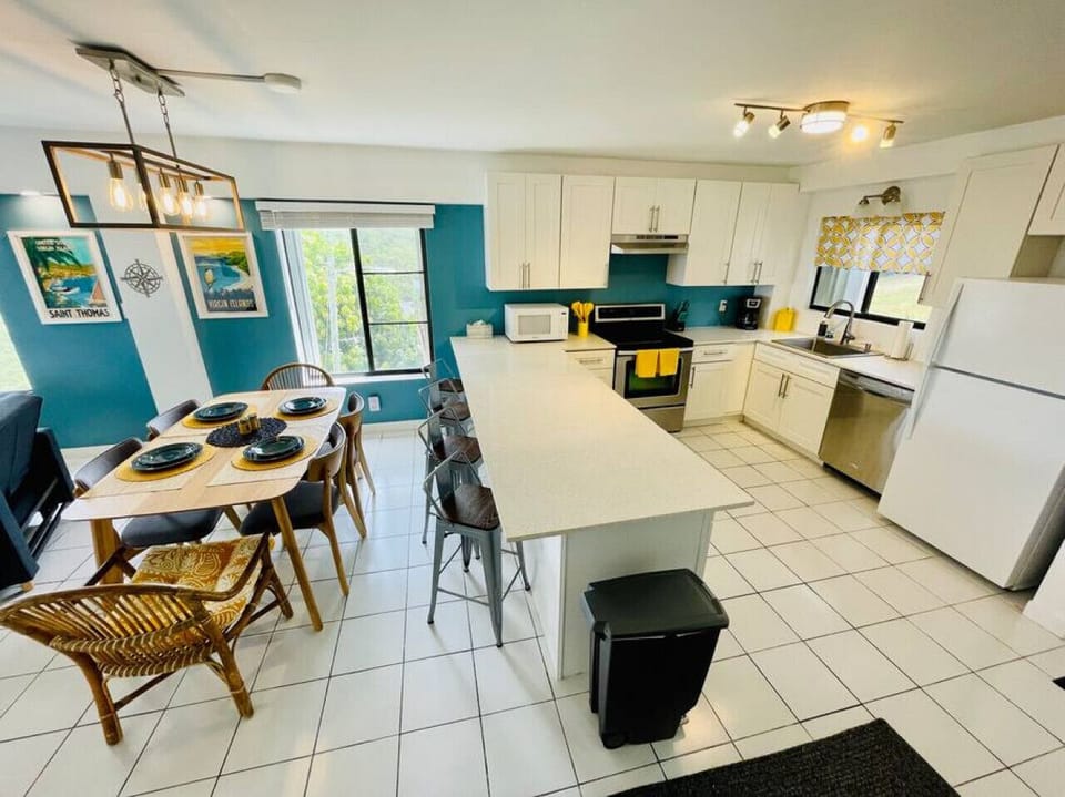 Fully Stocked Kitchen and Dining Area