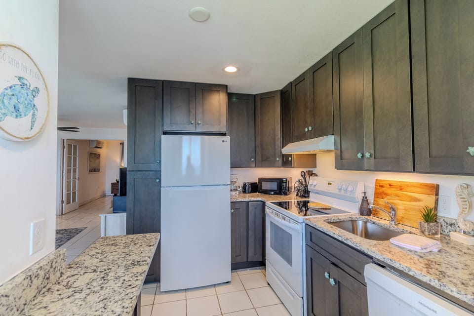 Kitchen includes cookware, dishes, coffee maker, and essentials
