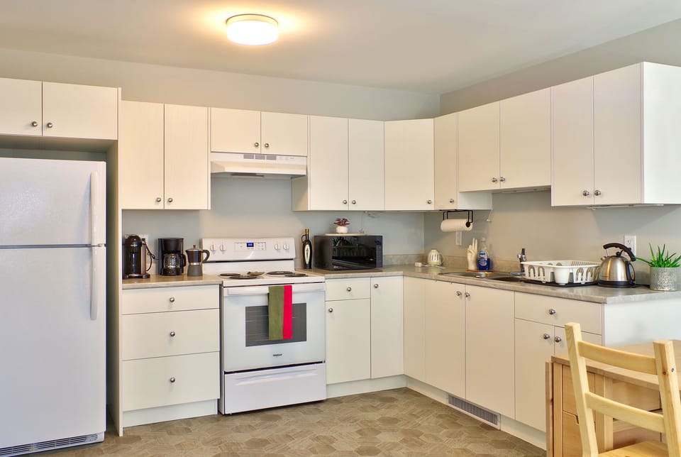 Spacious kitchen with all the comforts of home. Coffee, tea, sugar, creamer.